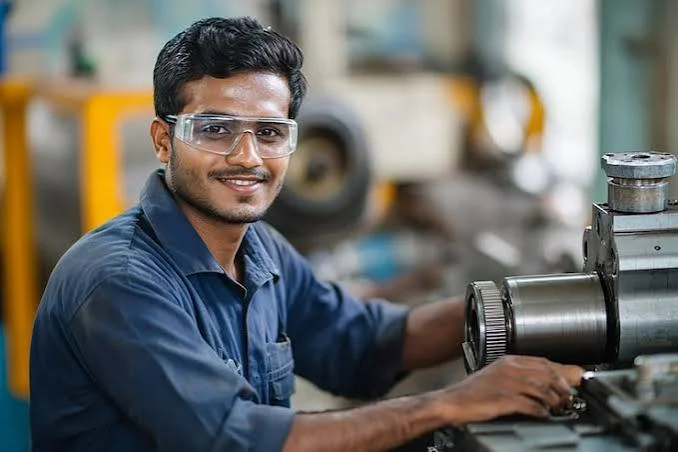 Technician servicing rotating equipment as part of a reliability program